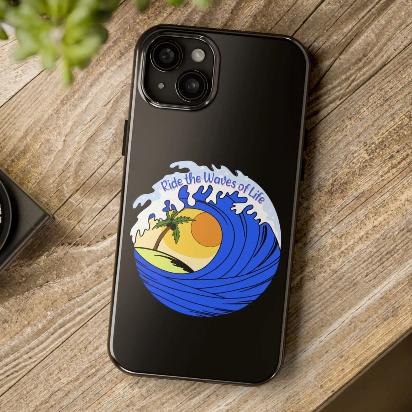 Black iPhone 15 Plus Case with wave with sun and palm tree in the middle that says Ride the Waves of Life.