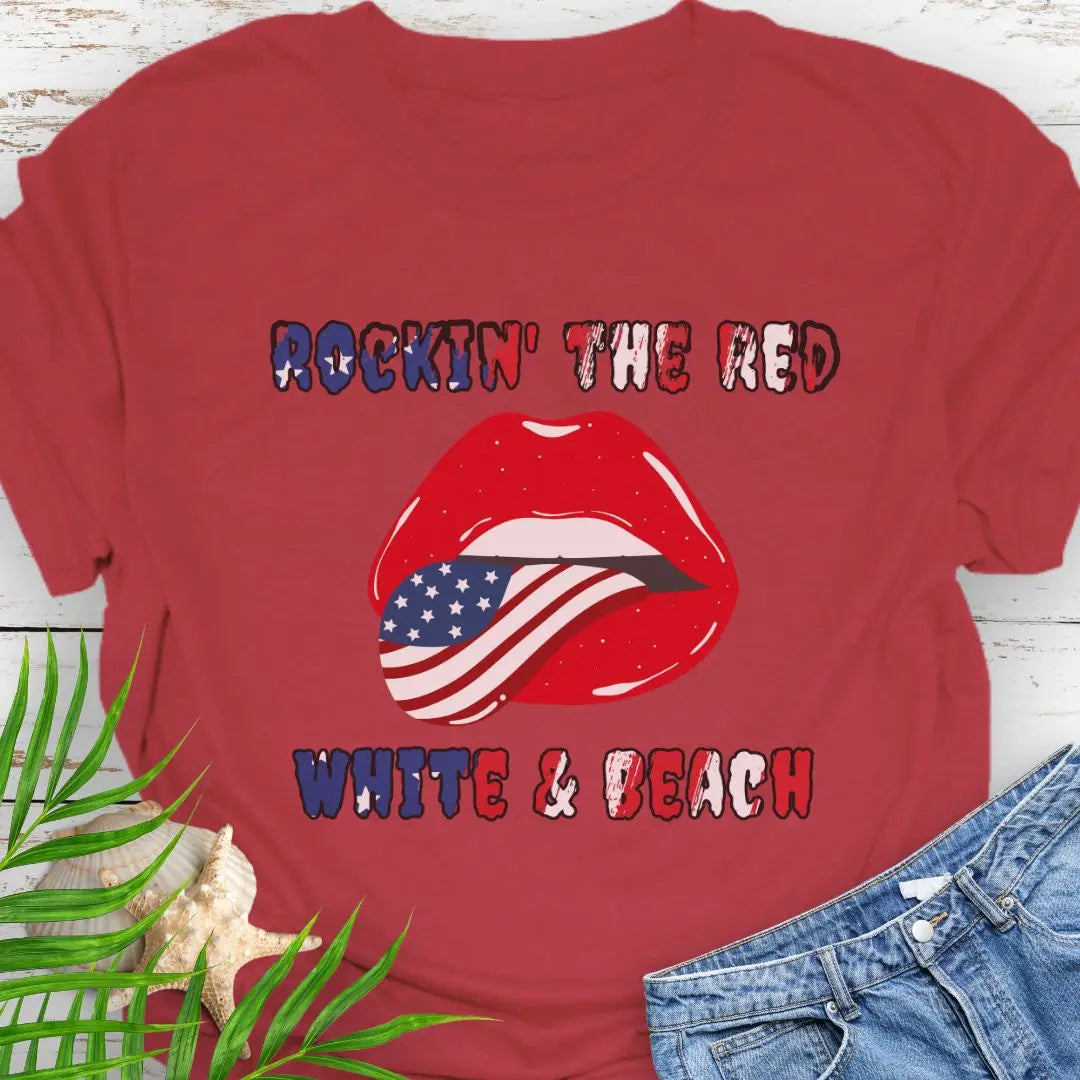 Cherry Red T-shirt with rolling stones lips with American flag tongue hanging out that says Rockin' the Red, White & Beach with text that is filled with the flag.