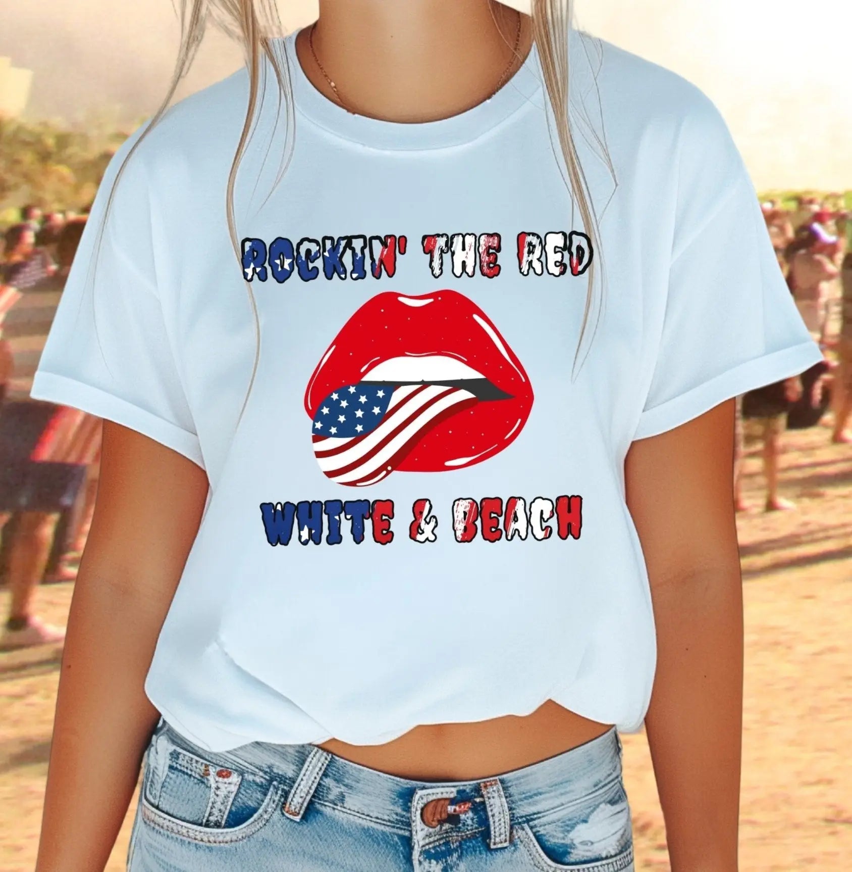 Woman wearing white T-shirt with rolling stones lips with american flag tongue hanging out that says Rockin' the Red, White & Beach.