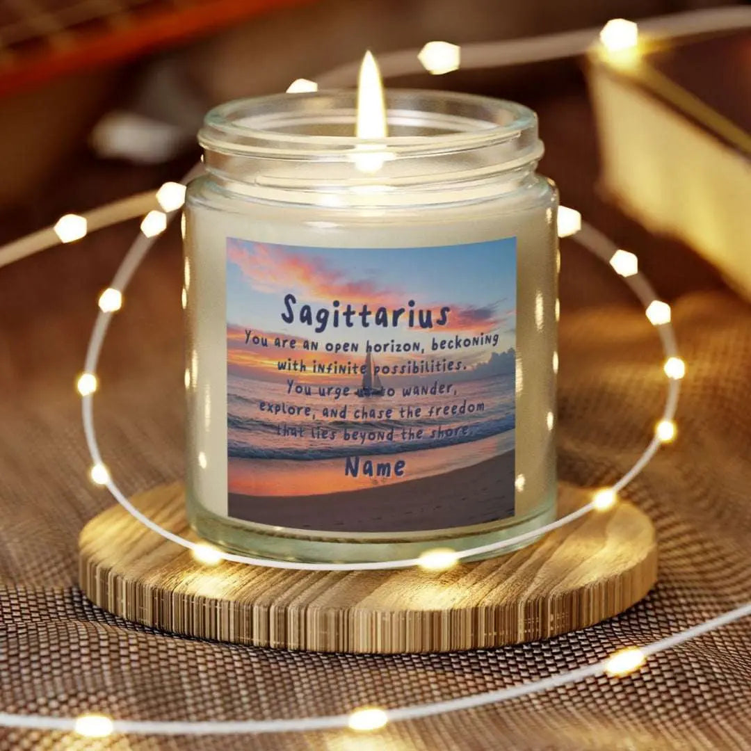 Elegant Sagittarius Zodiac hand-poured coconut apricot wax scented candle in a 4 oz Clear glass jar, featuring a picture of the ocean at sunset with a sailboat in the distance and an inspirational quote personalized. A beach-inspired astrology gift, perfect for relaxation and decor.