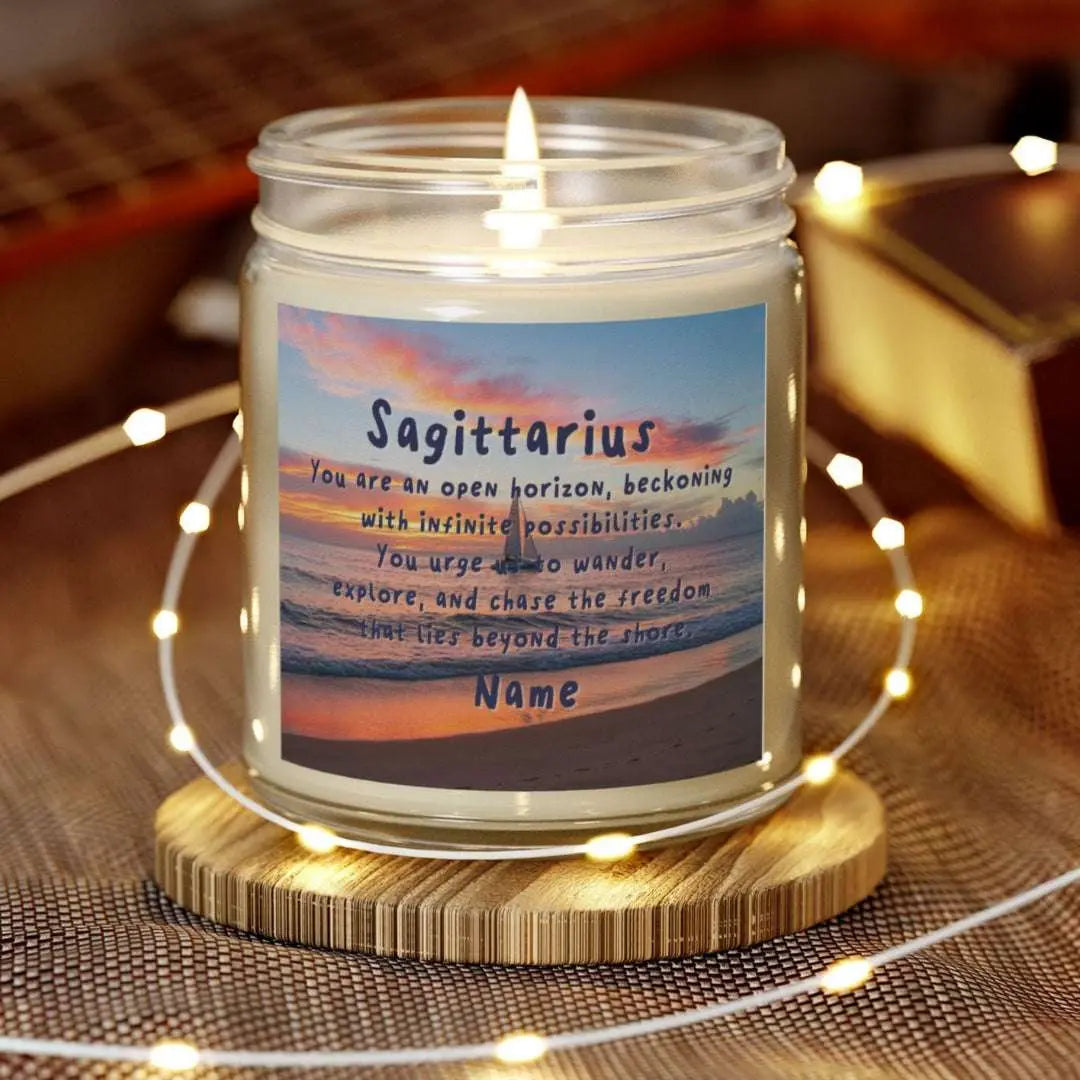 Elegant Sagittarius Zodiac hand-poured coconut apricot wax scented candle in a 9 oz clear glass jar, featuring a picture of the ocean at sunset with a sailboat in the distance and an inspirational quote personalized. A beach-inspired astrology gift, perfect for relaxation and decor.