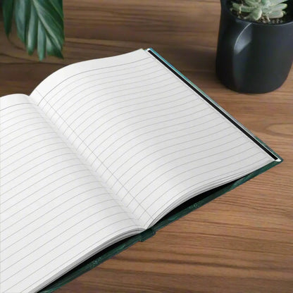 Open hardcover journal with 150 lined-page white lined paper perforated pages for easy removal.