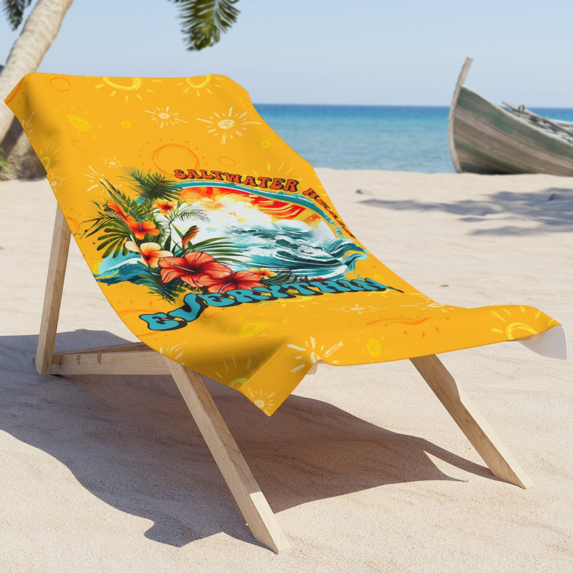 Bright yellow back with a picture of waves with tropical flowers that says Saltwater Heals Everything around the side of the image laying on a lounge chair on the beach.