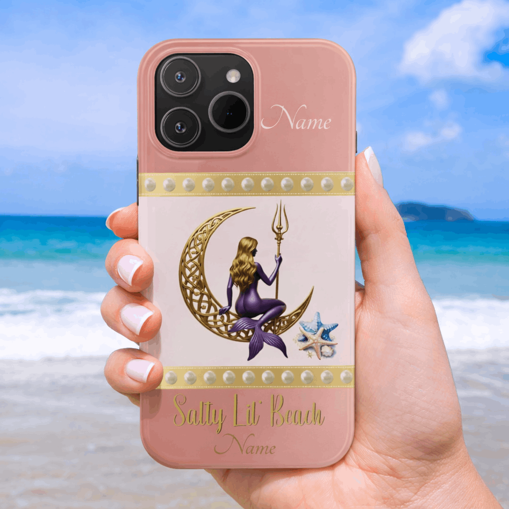 Phone case with mermaid design held by a hand on a beach background