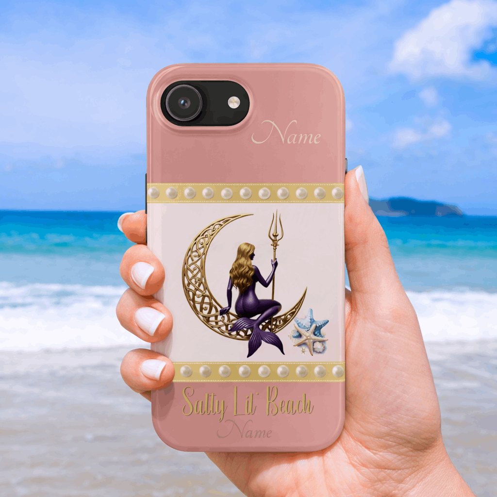 Phone case with mermaid design held by a hand on a beach background