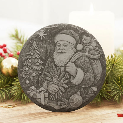 Decorative slate stone coaster with engraved image of Santa Claus.