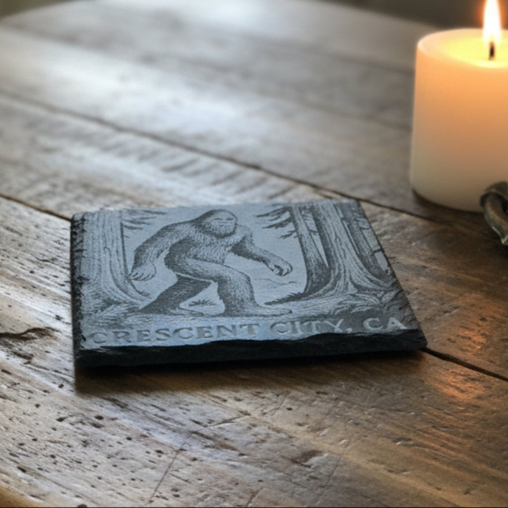 Coaster with a Sasquatch design and 'Crescent City, CA' text engraved.
