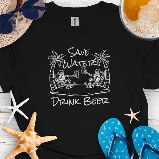 Black t-shirt with two skeletons on beach with beer mugs and text Save Water Drink Beer