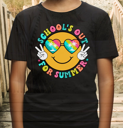 Child in black t-shirt with a beach themed smiley face that says Schools Out for Summer