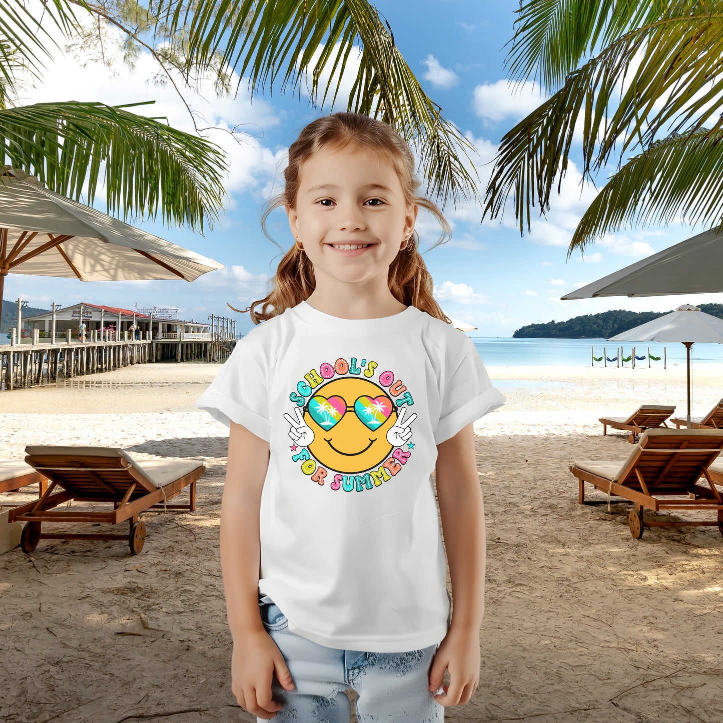 Child in white t-shirt with a beach themed smiley face that says Schools Out for Summer