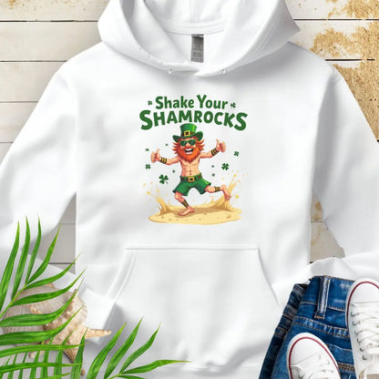 Shop our fun and cozy dancing leprechaun in beach attire with shamrock confetti with the text 'Shake Your Shamrocks' White Hoodie! Perfect for St. Patrick's Day celebrations or anyone who loves a touch of whimsy in their wardrobe.
