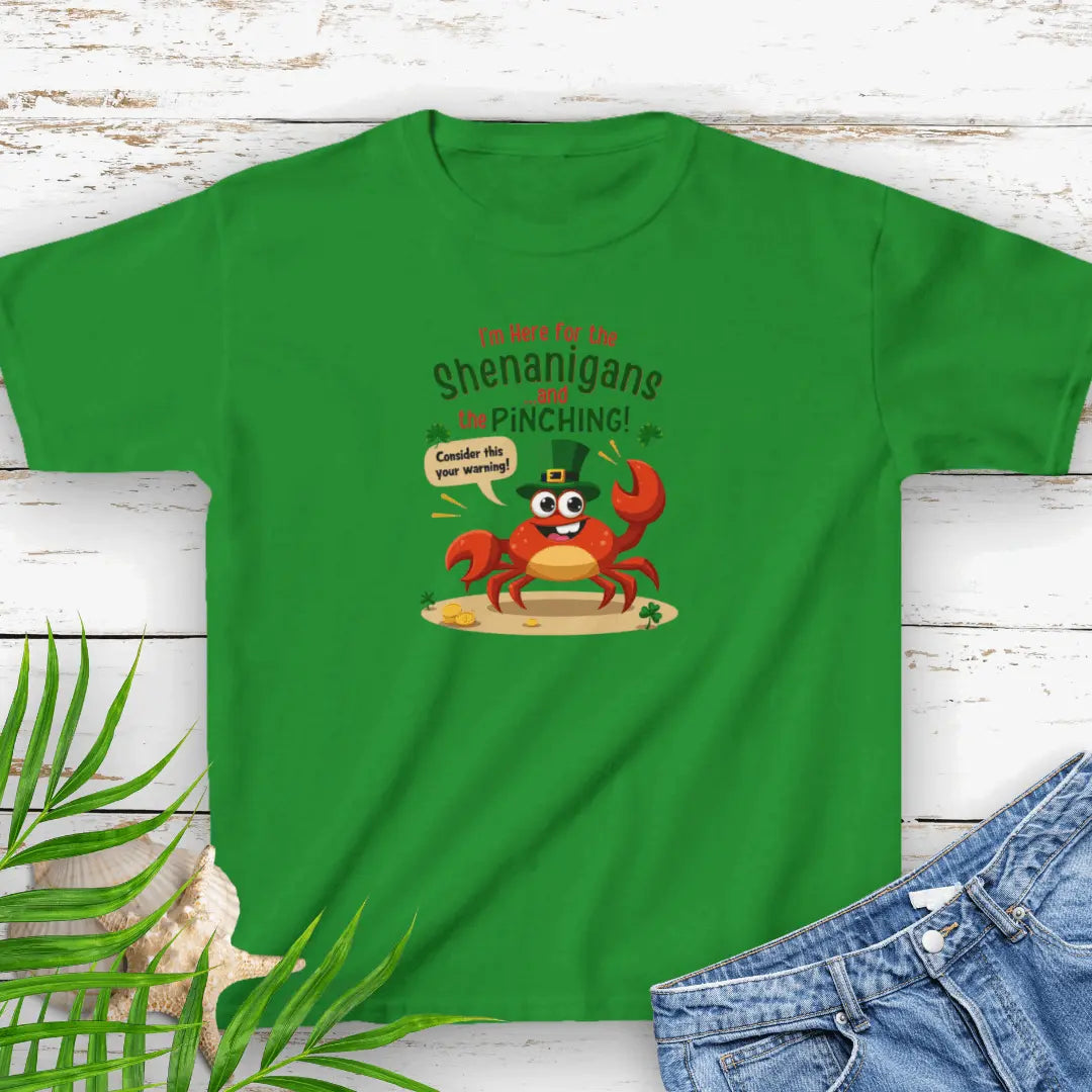 I'm Here for the Shenanigan's and the Pinching Green Small Child T-shirt with a cartoon crab wearing an Irish top hat sitting on the beach holding a sign that says consider this your warning. 