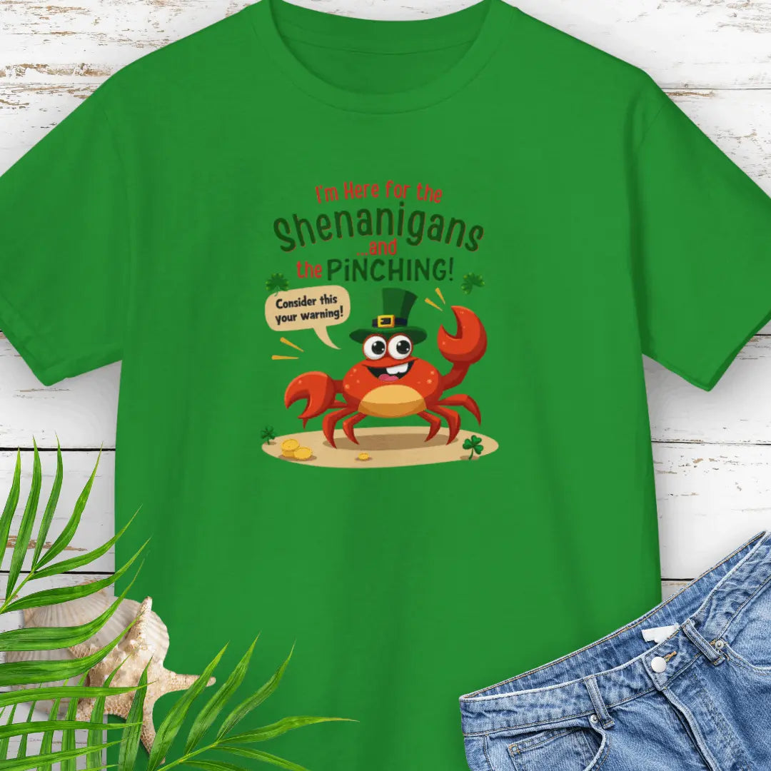 I'm Here for the Shenanigan's and the Pinching Green Child T-shirt with a cartoon crab wearing an Irish top hat sitting on the beach holding a sign that says consider this your warning. 