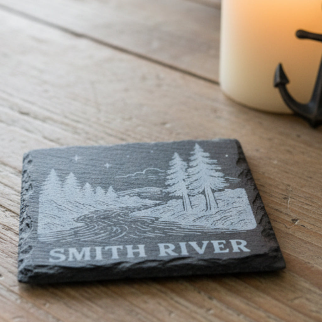 Slate coaster with engraved landscape and 'Smith River' text.