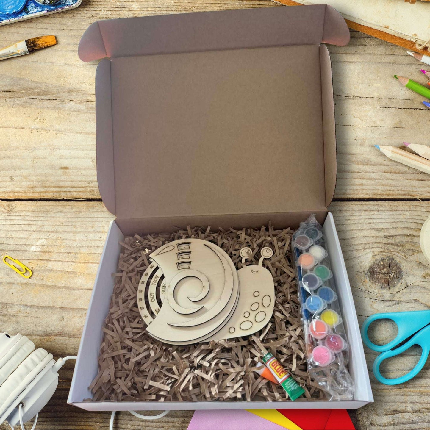 DIY Snail Perpetual Calendar kit for children with paint and glue.