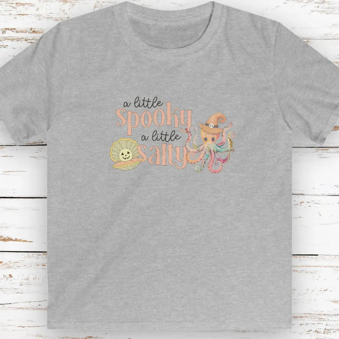 Gray kids t-shirt with pumpkin clam and octopus with witches hat with text that says a little spooky a little salty
