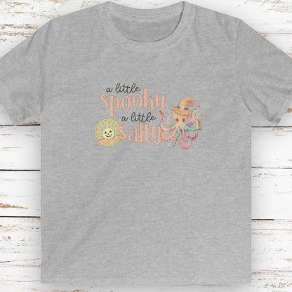 Gray kids t-shirt with pumpkin clam and octopus with witches hat with text that says a little spooky a little salty