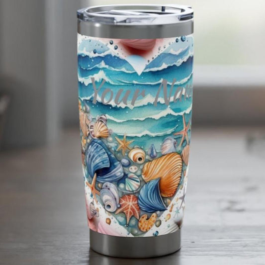 20 oz stainless steel tumbler with ocean wave heart on seashell background with personalized name.