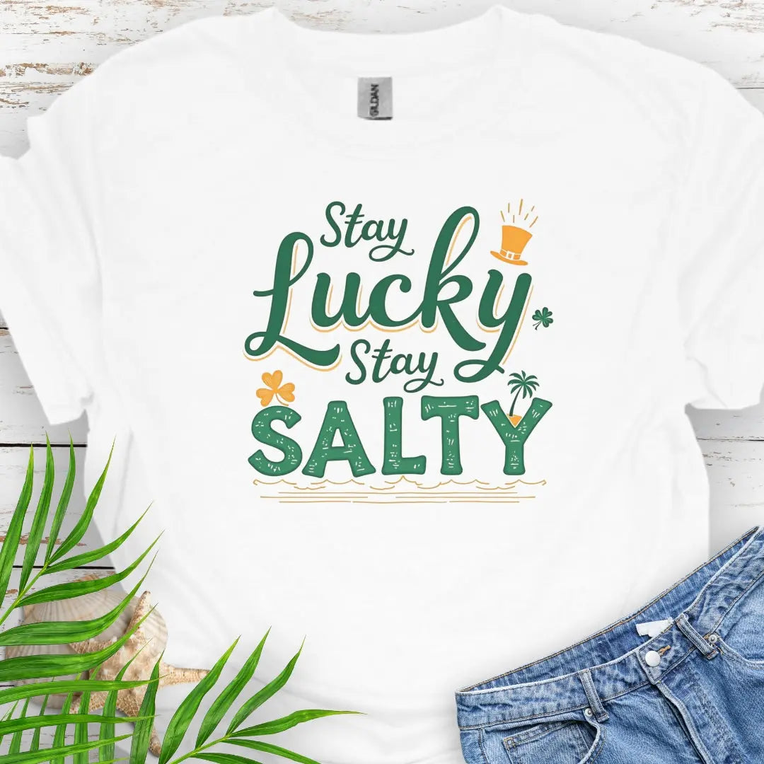 Our Stay Lucky Stay Salty White T-shirt with St. Patrick's Day and beach embellishments including shamrock, leprechaun hat, palm tree and ocean waves.