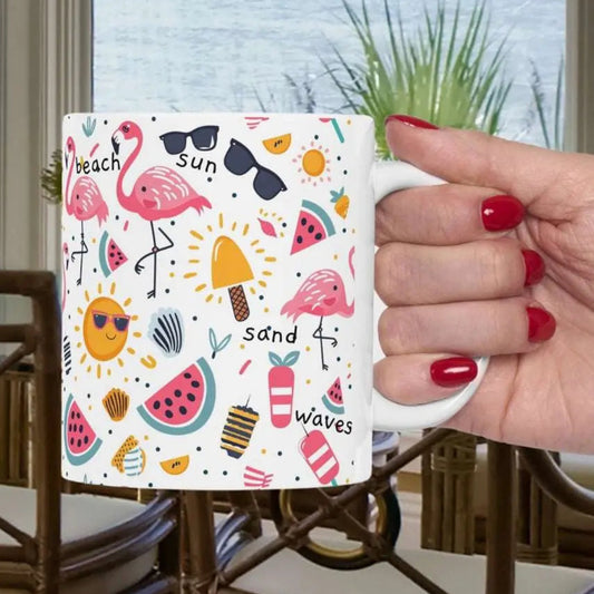 White beach-themed 11 oz coffee mug and white handle with colorful fun designs featuring flamingos, watermelon slices, sun, and popsicles. Perfect summer mug for beach lovers, tropical vibes, and sunny morning coffee.