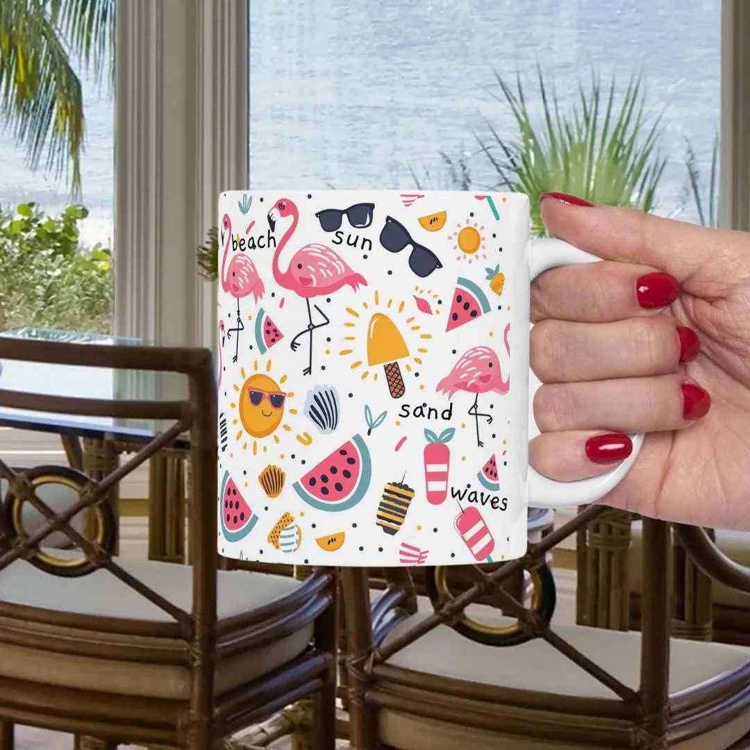 White beach-themed 11 oz coffee mug and white handle with colorful fun designs featuring flamingos, watermelon slices, sun, and popsicles. Perfect summer mug for beach lovers, tropical vibes, and sunny morning coffee.