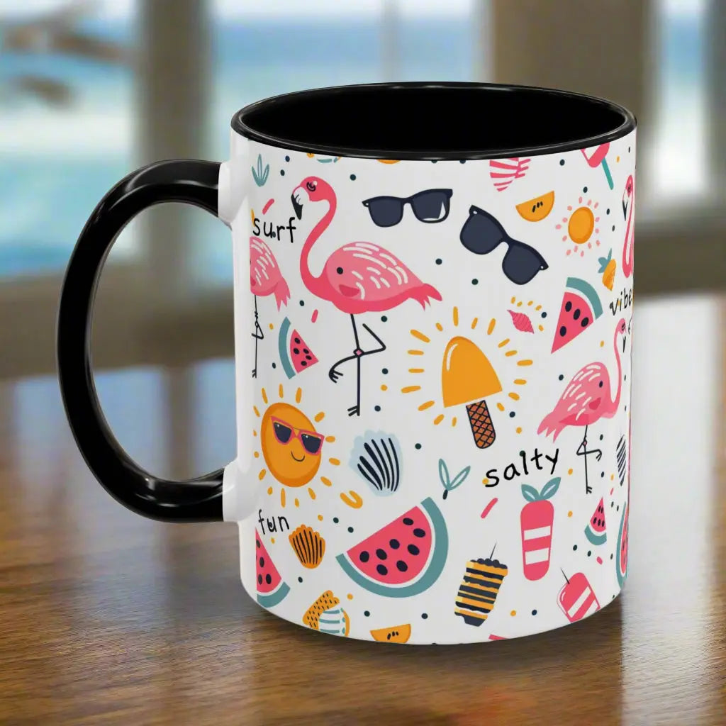 White beach-themed 11 oz coffee mug with black inside and handle with colorful fun designs featuring flamingos, watermelon slices, sun, and popsicles. Perfect summer mug for beach lovers, tropical vibes, and sunny morning coffee.