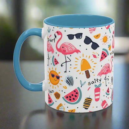 White beach-themed 11 oz coffee mug with Light Blue inside and handle colorful fun designs featuring flamingos, watermelon slices, sun, and popsicles. Perfect summer mug for beach lovers, tropical vibes, and sunny morning coffee.
