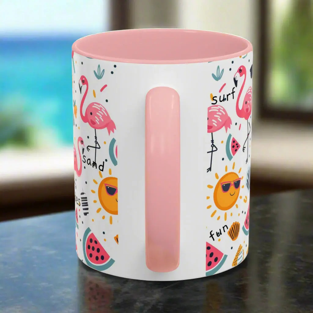Side view of White beach-themed coffee mug with pink inside and handle with  colorful fun designs featuring flamingos, watermelon slices, sun, and popsicles. Perfect summer mug for beach lovers, tropical vibes, and sunny morning coffee.