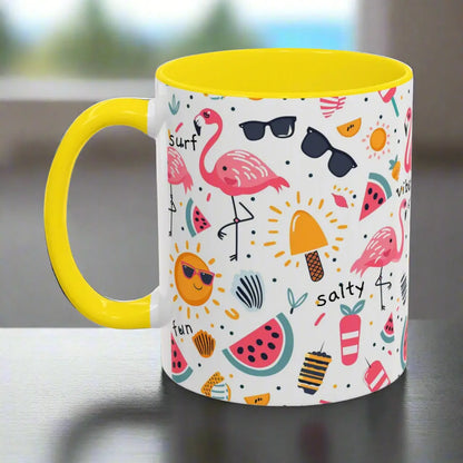 White beach-themed 11 oz coffee mug with yellow inside and handle with colorful fun designs featuring flamingos, watermelon slices, sun, and popsicles. Perfect summer mug for beach lovers, tropical vibes, and sunny morning coffee.