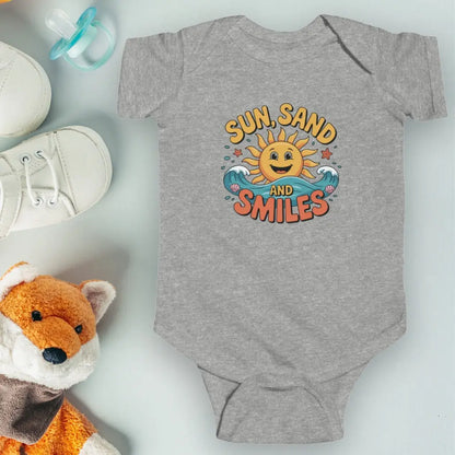 Gray One-piece short-sleeved infant bodysuit with a smiley sun and waves that says Sun, Sand and Smiles.