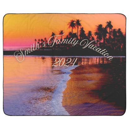 Personalized family vacation outdoor beach blanket with waterproof back with palm trees and sunset design.