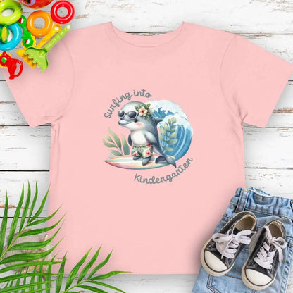 Surfing Into Kindergarten Pink Toddler's T-shirt with a fun dolphin surfing.