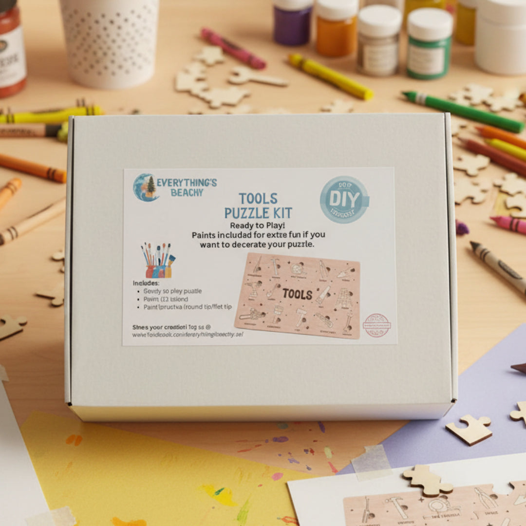 A white box labeled “Tools Puzzle Kit” with a printed card showing puzzle pieces and paint supplies.
