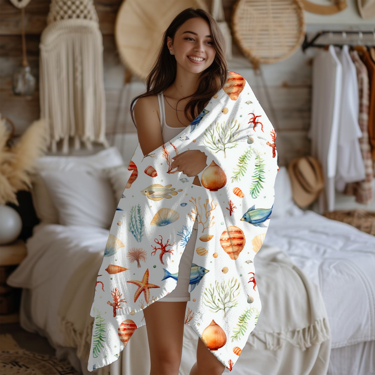 White blanket with fish, starfish, seashells and underwater plant life.