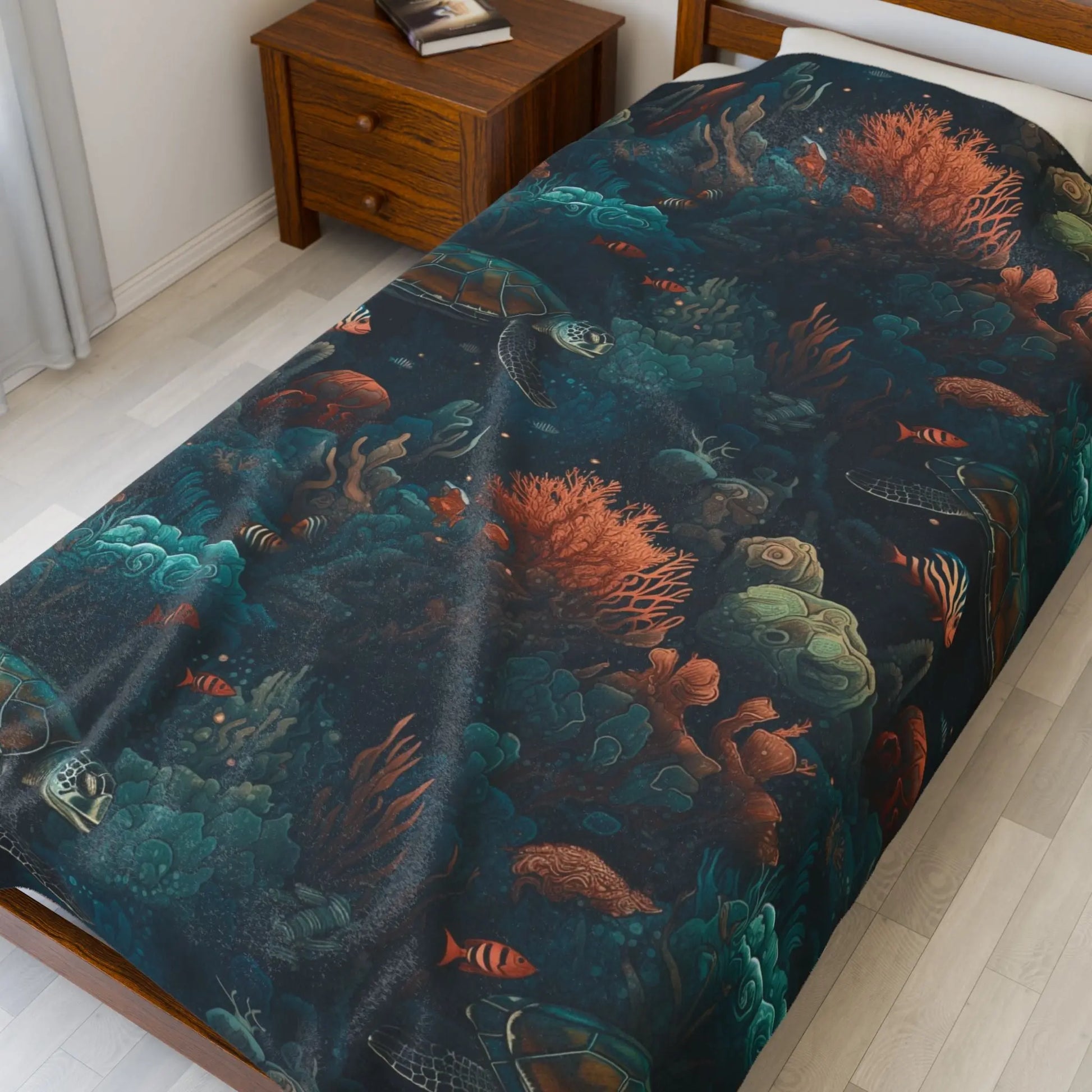 Our Velveteen 60x80" Plush Blanket with a dark underwater scene with coral, fish and sea turtles.