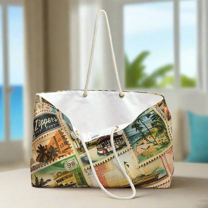 Our Vintage Traveler Weekender Tote Bag constructed from a durable material with a rope handle with metal grommets featuring an array of vintage stamps. 
