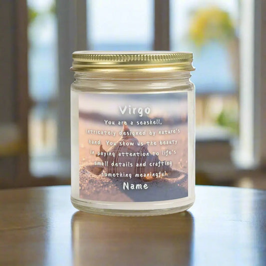 Elegant Virgo Zodiac hand-poured coconut apricot wax scented candle in a 9 oz clear glass jar with gold lid, featuring a Seashell in the sand with waves coming in and an inspirational quote personalized. A beach-inspired astrology gift, perfect for relaxation and decor.