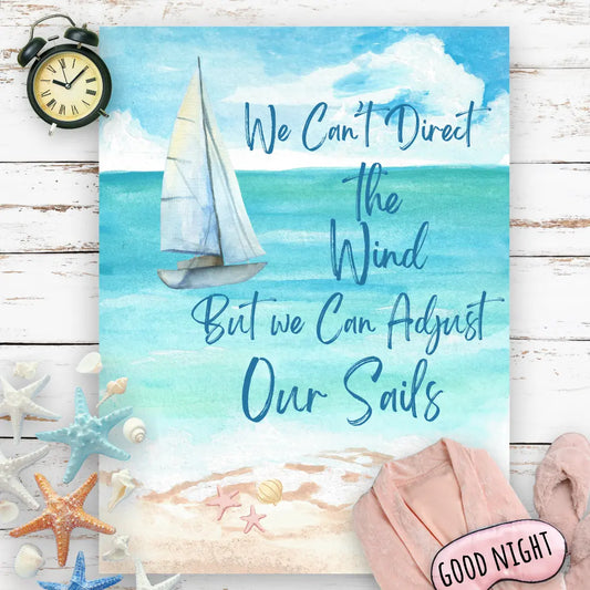 Blanket with Beach scene with the text We Can't Direct the Wind But We Can Adjust the Sails