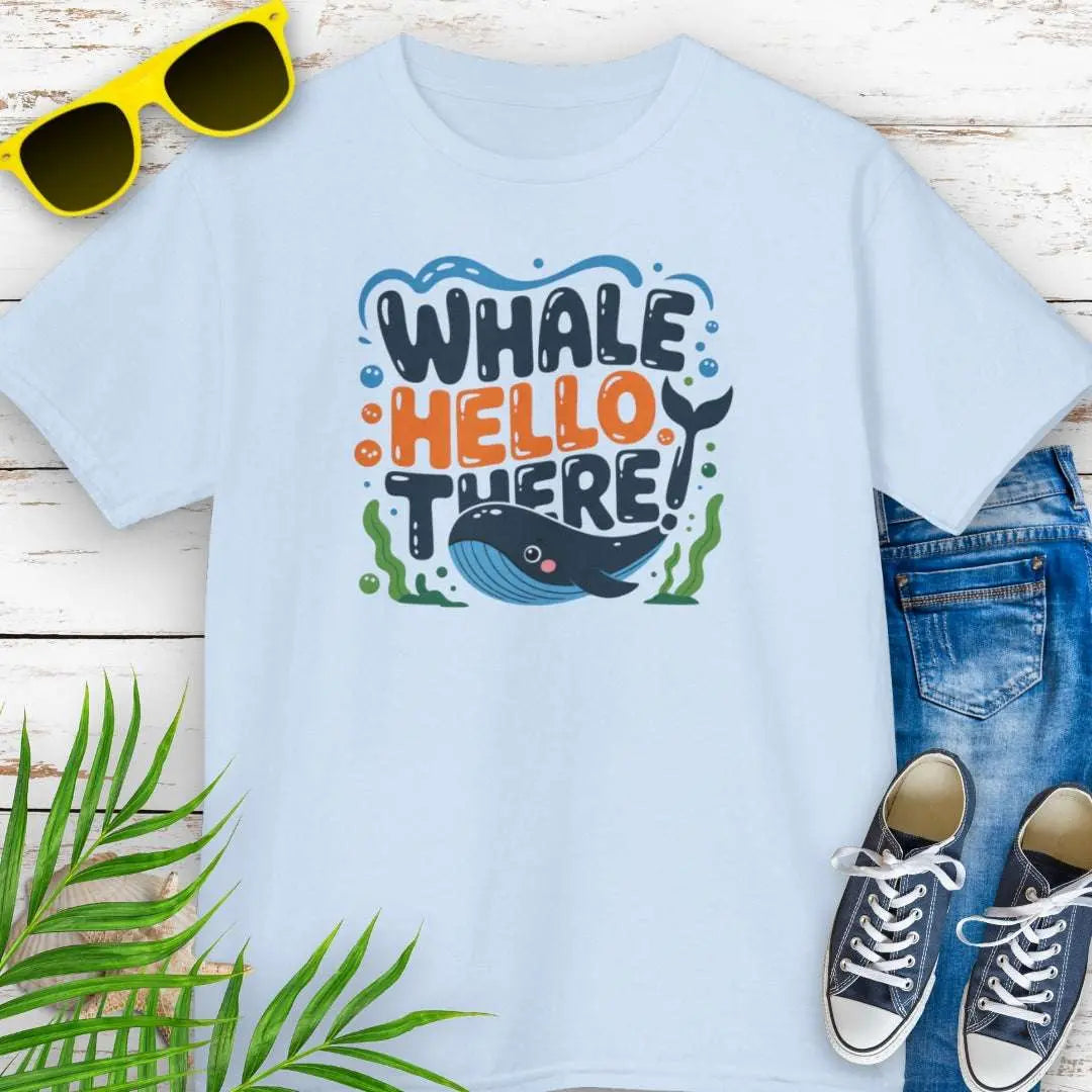 Whale Hello Child's T-Shirt Light Blue T-Shirt with a fun whale swimming under the text with water bubbles and seaweed.