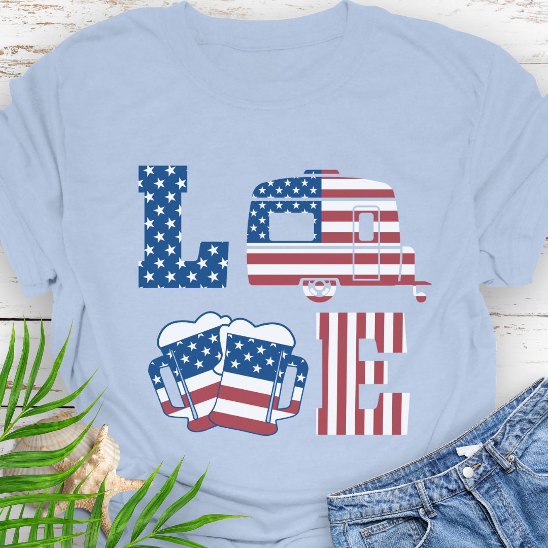 Light Blue T-shirt with patriotic LOVE design: blue star-patterned L, American flag camper as O, beer mugs forming V, and red-striped E – playful 4th of July theme.