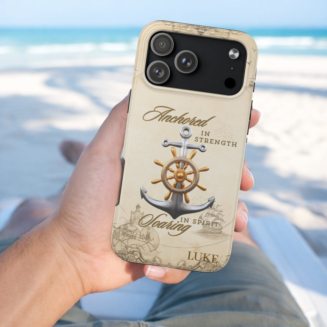 Phone case with anchor design and text held by a person on a beach.