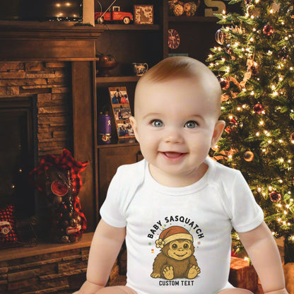Baby wearing a onesie with a Sasquatch design with custom text.