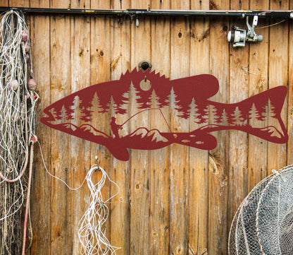 Red  intricate metal art sign featuring a bass fish with a man fishing inside the fish. A unique and detailed design, perfect for fishing enthusiasts and rustic home or cabin decor.