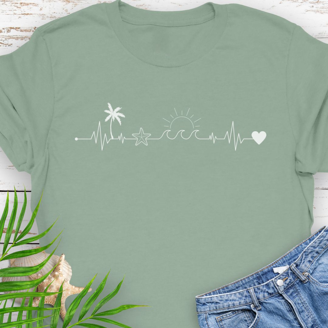 Sage T-shirt with heartbeat line featuring palm tree, starfish, and ocean wave.