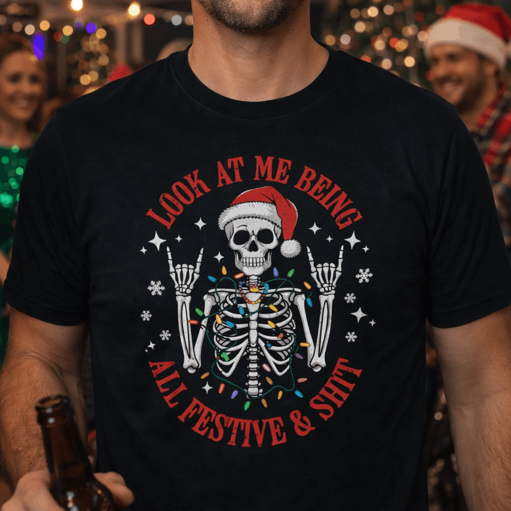 Person wearing a black t-shirt with a festive skeleton design and text Look at Me Being All Festive & Shit.