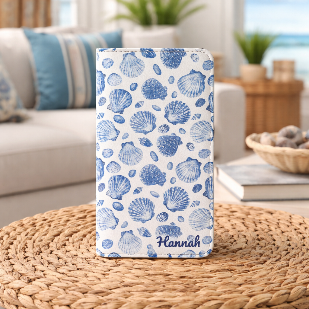 Personalized flip phone case with hand-drawn blue seashell pattern on faux leather