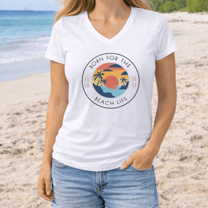 Woman wearing a 'Born for the Beach Life' t-shirt on a beach