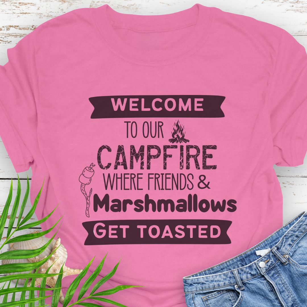 Azalea Pink Funny “Welcome to Our Campfire Where Friends & Marshmallows Get Toasted” t-shirt with bold text design for campers and party lovers.