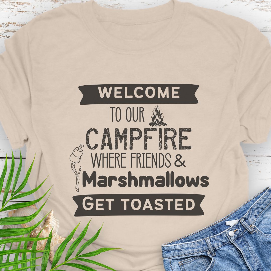 Natural Funny “Welcome to Our Campfire Where Friends & Marshmallows Get Toasted” t-shirt with bold text design for campers and party lovers.