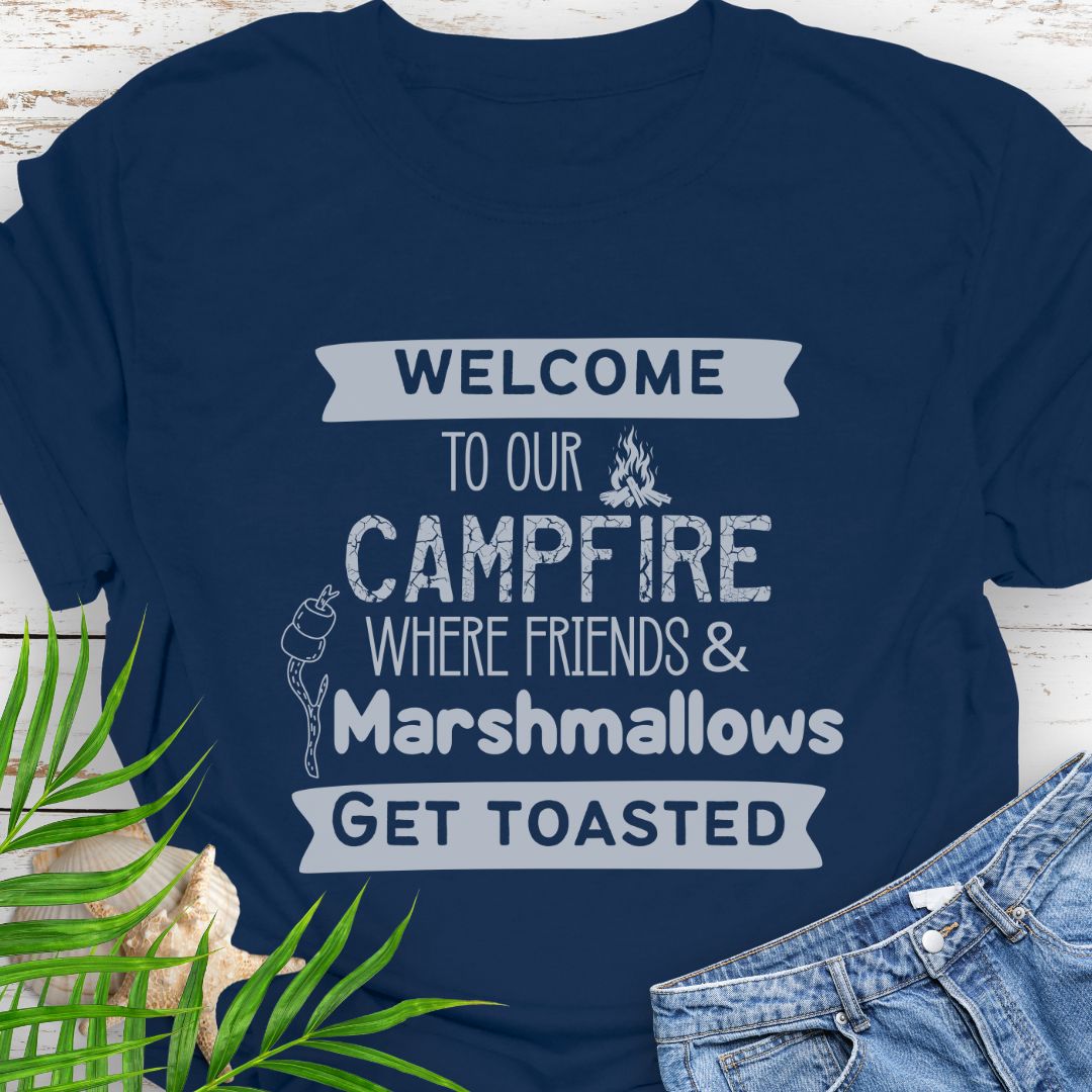Navy Blue Funny “Welcome to Our Campfire Where Friends & Marshmallows Get Toasted” t-shirt with bold text design for campers and party lovers.
